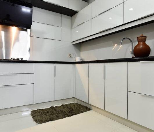 all-white-glossy-kitchen-interior-parkland-thrissur-kerala