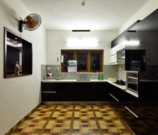 black-white-modern-kitchen-with-pattern-backsplash-parkland-thrissur-kerala