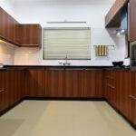 Classic wood finish u shaped kitchen parkland thrissur kerala