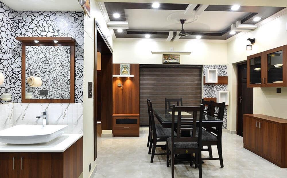 interior-designers-in-thrissur-elegant-dining-under-staircase