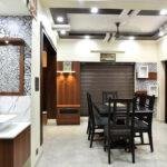 Interior designers in thrissur elegant dining under staircase