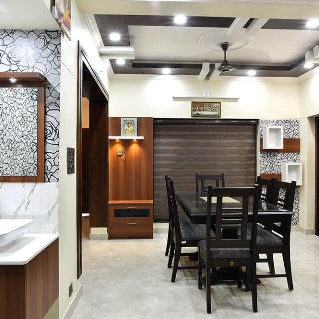 interior-designers-in-thrissur-elegant-dining-under-staircase