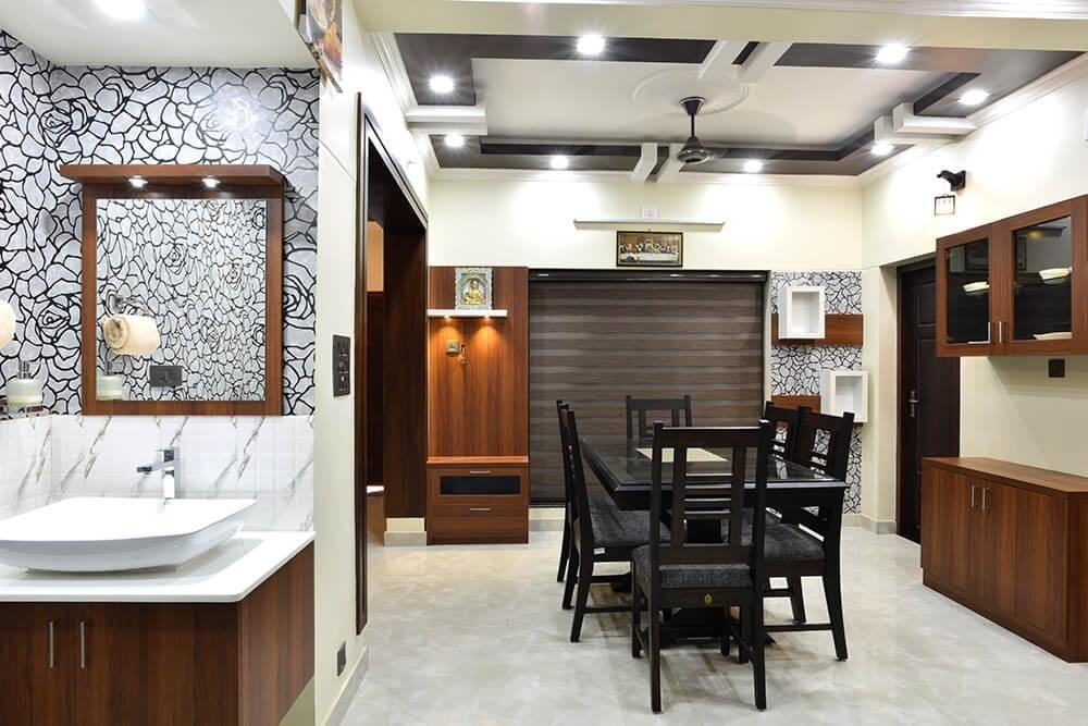 interior-designers-in-thrissur-elegant-dining-under-staircase