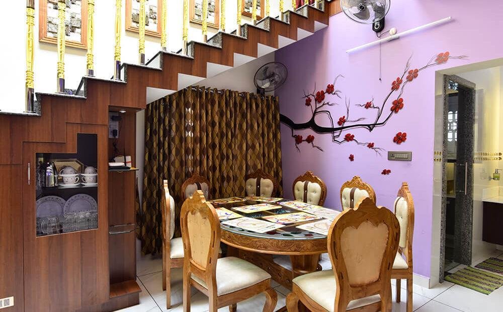 interior-designers-in-thrissur-elegant-dining-under-staircase