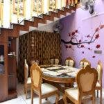Interior designers in thrissur elegant dining under staircase