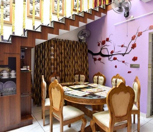 interior-designers-in-thrissur-elegant-dining-under-staircase