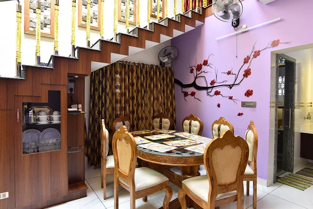 interior-designers-in-thrissur-elegant-dining-under-staircase