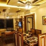 Interior designers in thrissur luxury apartment dining and living area angle