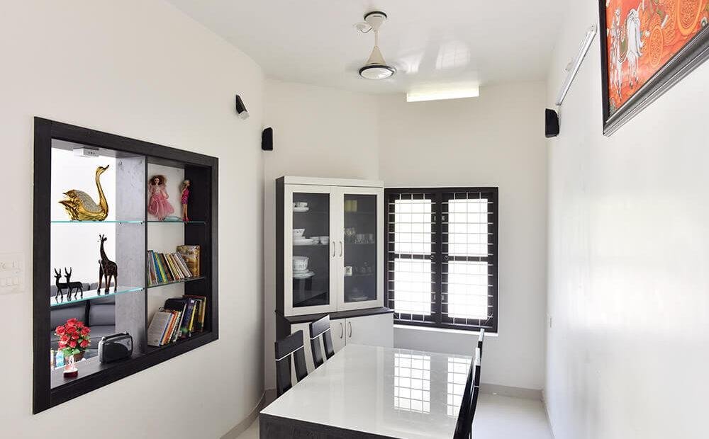 interior-designers-in-thrissur-minimalist-dining-room-with-display-shelves