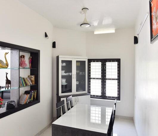 interior-designers-in-thrissur-minimalist-dining-room-with-display-shelves