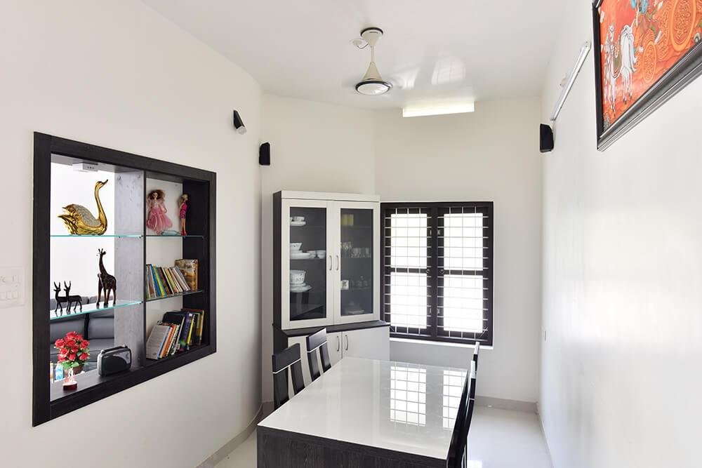 interior-designers-in-thrissur-minimalist-dining-room-with-display-shelves