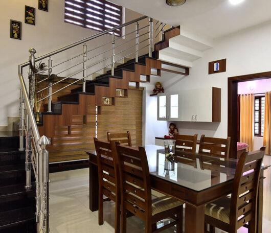 interior-designers-in-thrissur-modern-dining-room-with-staircase-angle1