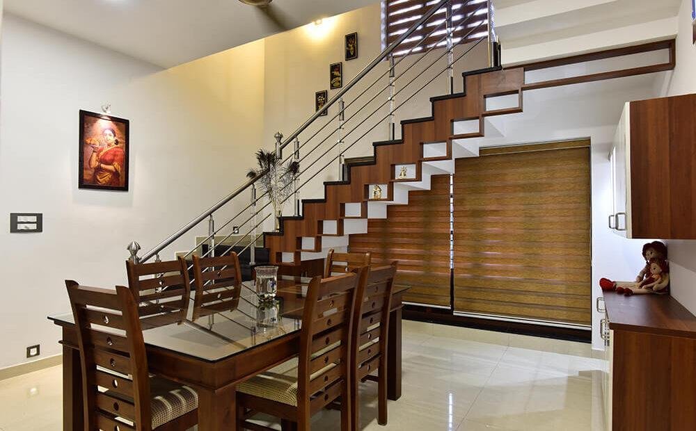 interior-designers-in-thrissur-modern-dining-room-with-staircase-angle2
