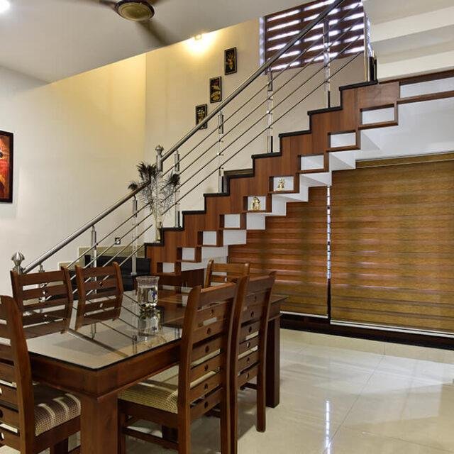 interior-designers-in-thrissur-modern-dining-room-with-staircase-angle2