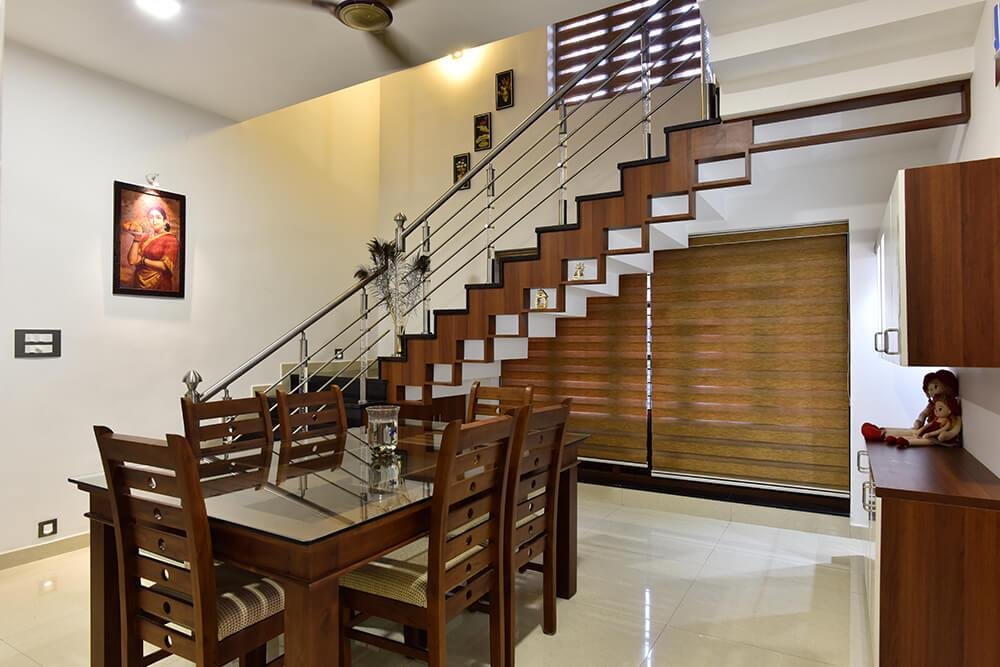 interior-designers-in-thrissur-modern-dining-room-with-staircase-angle2