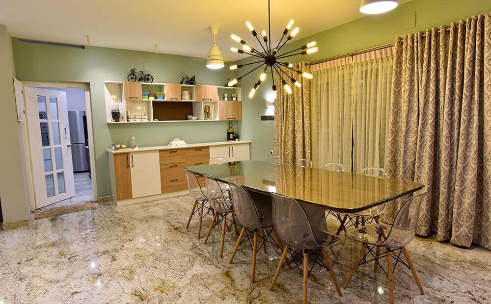 interior-designers-in-thrissur-modern-minimalist-dining-space-with-designer-lighting-angle1