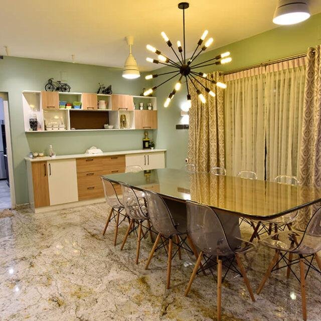 interior-designers-in-thrissur-modern-minimalist-dining-space-with-designer-lighting-angle1