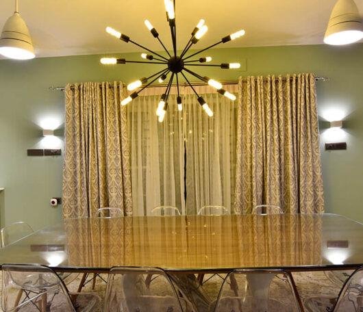 interior-designers-in-thrissur-modern-minimalist-dining-space-with-designer-lighting-angle2