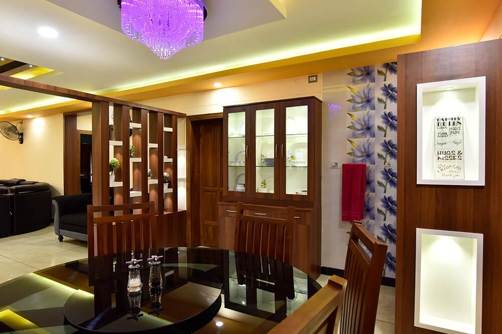 interior-designers-in-thrissur-vibrant-dining-room-with-glass-cabinet-angle1