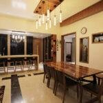 Interior designers in thrissur wood finish dining and bar area