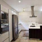 Open kitchen with breakfast counter parkland thrissur kerala