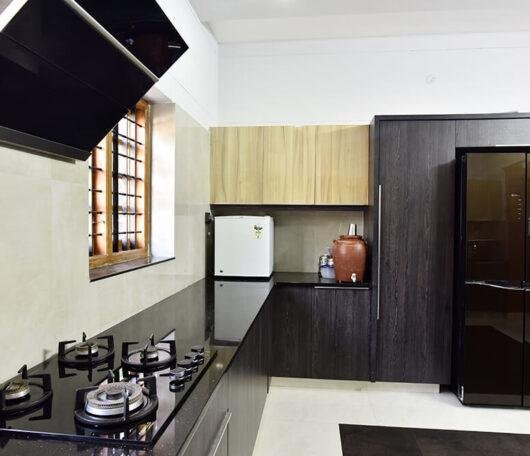 modern-black-wood-finish-kitchen-parkland-thrissur-kerala