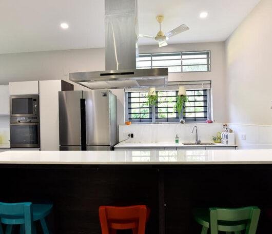 open-kitchen-with-breakfast-counter-parkland-thrissur-kerala