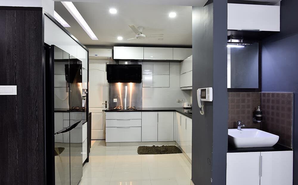 sleek-white-modern-kitchen-design-parkland-thrissur-kerala