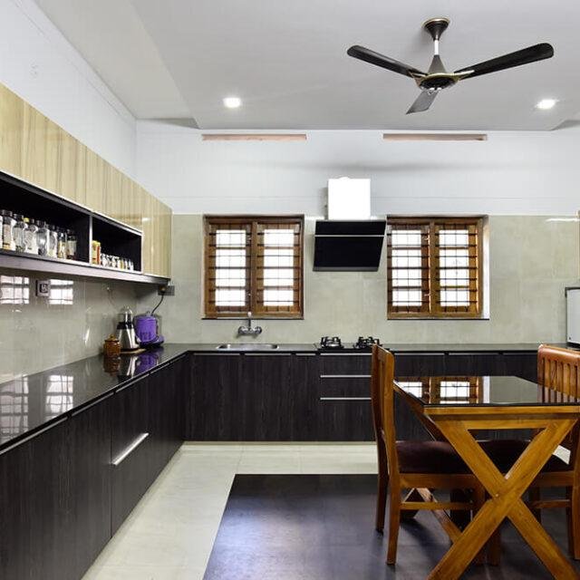 two-tone-wood-black-modular-kitchen-parkland-thrissur-kerala