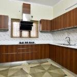 U shaped wood finish modular kitchen parkland thrissur kerala