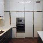 White high gloss minimalist kitchen parkland thrissur kerala
