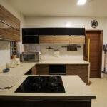 Wood grain black modern kitchen parkland thrissur, kerala